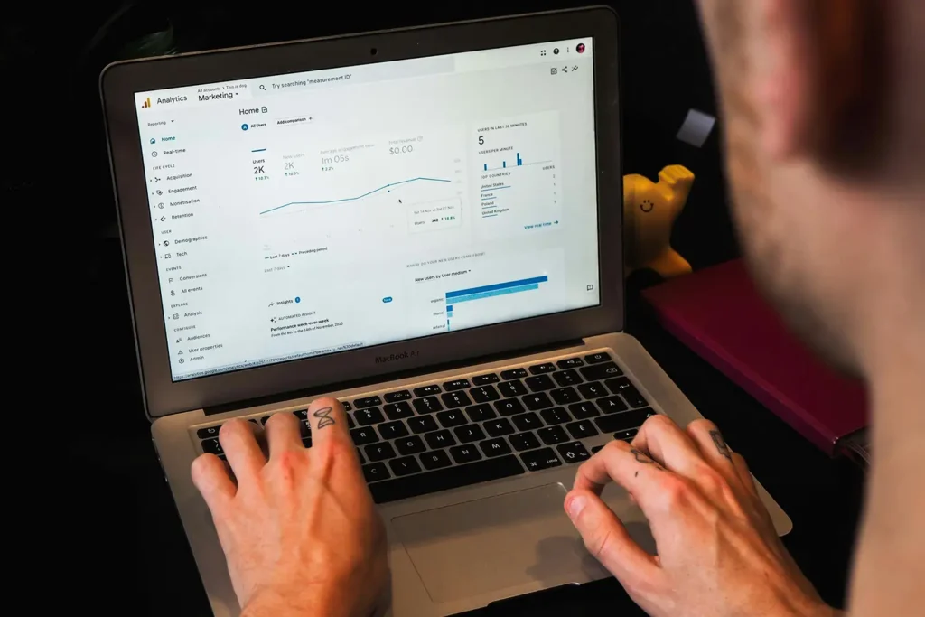 man using a laptop to research SEO