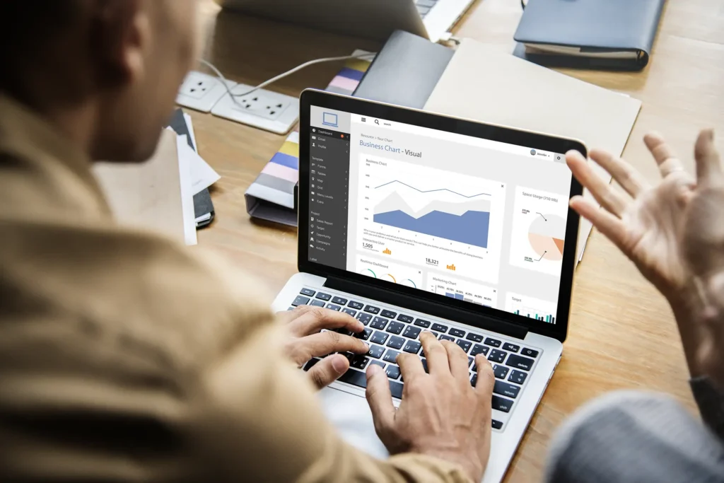 guy checking rankings on a laptop