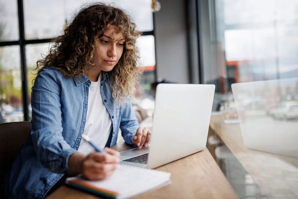 woman looking at laptop